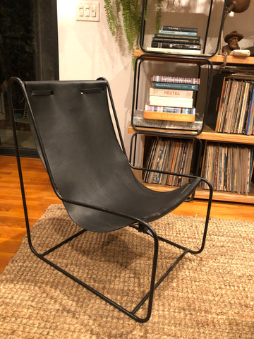 Black on black sling chair